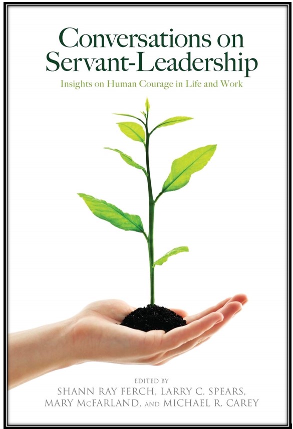 White book cover with image of a hand holding a seedling plant